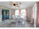 Dining room with white table and chairs, and pink curtains at 2100 Brian Ave, South Daytona, FL 32119