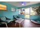 Relaxing screened porch with patio furniture and access to the backyard at 2100 Brian Ave, South Daytona, FL 32119