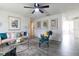 Bright living room features a pink couch, patterned arm chair, and coffee table at 2100 Brian Ave, South Daytona, FL 32119