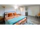 Spacious bedroom with a queen bed and orange accents at 2100 Brian Ave, South Daytona, FL 32119