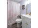 Bathroom with a “get naked” shower curtain and gold fixtures at 2100 Brian Ave, South Daytona, FL 32119