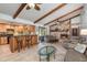 Open floor plan boasts a kitchen with island and a living room featuring a stone fireplace at 573 Pelican Bay Dr, Daytona Beach, FL 32119