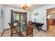Bright dining area with glass top table and access to the backyard patio at 573 Pelican Bay Dr, Daytona Beach, FL 32119