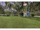 Front view of charming house with stone accents and landscaping at 573 Pelican Bay Dr, Daytona Beach, FL 32119
