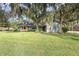 Home exterior featuring a light blue house with stone accents at 573 Pelican Bay Dr, Daytona Beach, FL 32119