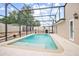 Refreshing screened-in pool with a water feature at 2291 Henry Ln, Deltona, FL 32738