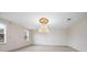 Empty dining room with large windows and a chandelier at 2291 Henry Ln, Deltona, FL 32738