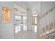 Grand entryway with white stone detailing and a view of the living area at 2291 Henry Ln, Deltona, FL 32738