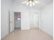 Charming bedroom with mirrored closet doors and access to a loft area at 2291 Henry Ln, Deltona, FL 32738