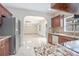 Kitchen with granite countertops and view of the living room at 2291 Henry Ln, Deltona, FL 32738