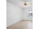 Spacious bedroom with a ceiling fan and large window, offering ample natural light at 2291 Henry Ln, Deltona, FL 32738