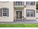 Front entry with double door and decorative urns at 2291 Henry Ln, Deltona, FL 32738
