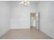 Spacious bedroom with mirrored closet doors and access to a hallway at 2291 Henry Ln, Deltona, FL 32738