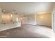 Open concept living and dining area with neutral colors and carpeted floors at 1631 Primo Ct, Holly Hill, FL 32117