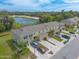 Aerial view of townhouses near a lake at 1631 Primo Ct, Holly Hill, FL 32117