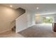 Carpeted staircase leading to the second floor of the home at 1631 Primo Ct, Holly Hill, FL 32117