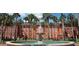 Fountain in a courtyard, surrounded by palm trees and a red brick building at 1402 Talton Ave, Deland, FL 32720