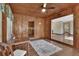 Charming wood paneled sunroom with built-in seating at 1402 Talton Ave, Deland, FL 32720