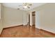Bright bedroom with hardwood floors and mirrored closet doors at 1402 Talton Ave, Deland, FL 32720