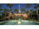 View of a fountain with a building and palm trees in the background at 1402 Talton Ave, Deland, FL 32720