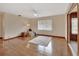 Relaxing living room with hardwood floors and access to a sunroom at 1402 Talton Ave, Deland, FL 32720