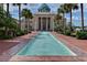 Long reflecting pool in a courtyard with benches and palm trees at 1402 Talton Ave, Deland, FL 32720