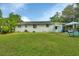 Ranch-style home exterior with large backyard at 1402 Talton Ave, Deland, FL 32720