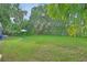 Expansive backyard with lush lawn and mature trees at 1402 Talton Ave, Deland, FL 32720