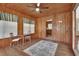 Bright sunroom with wood walls and large windows at 1402 Talton Ave, Deland, FL 32720