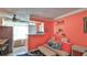 Small kitchenette with a mini-fridge and seating area at 935 S Atlantic Ave # 206, Daytona Beach, FL 32118