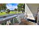 Relaxing balcony with seating, small table, and view of the street at 935 S Atlantic Ave # 206, Daytona Beach, FL 32118