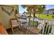 Balcony with ocean view, seating area, and tropical plants at 935 S Atlantic Ave # 206, Daytona Beach, FL 32118
