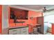 Living area with large TV, dresser, and kitchenette visible at 935 S Atlantic Ave # 206, Daytona Beach, FL 32118