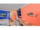 Living area featuring a large TV and coastal decor at 935 S Atlantic Ave # 206, Daytona Beach, FL 32118