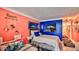 Beach-themed bedroom with coral and blue walls at 935 S Atlantic Ave # 206, Daytona Beach, FL 32118