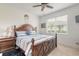 Main bedroom with a wood bed frame and blue bedding at 623 Margaritaville Ave, Daytona Beach, FL 32124