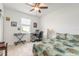 Bright bedroom with a comfortable bed, desk, and tiled floors at 623 Margaritaville Ave, Daytona Beach, FL 32124