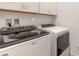 Bright laundry room featuring Whirlpool washer and dryer at 623 Margaritaville Ave, Daytona Beach, FL 32124