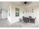 Screened porch with table and chairs at 623 Margaritaville Ave, Daytona Beach, FL 32124