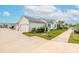 White home with teal accents and two-car garage at 623 Margaritaville Ave, Daytona Beach, FL 32124