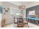 Bright dining room featuring a glass table and wicker chairs at 623 Margaritaville Ave, Daytona Beach, FL 32124