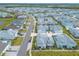 Aerial view of a neighborhood with pastel colored houses at 623 Margaritaville Ave, Daytona Beach, FL 32124