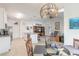 Open kitchen with island, stainless steel appliances, and breakfast nook at 623 Margaritaville Ave, Daytona Beach, FL 32124