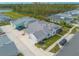 Aerial view of a house with a large backyard and surrounding houses at 623 Margaritaville Ave, Daytona Beach, FL 32124