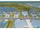 Aerial view of a waterfront community with colorful houses at 623 Margaritaville Ave, Daytona Beach, FL 32124
