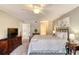 Comfortable bedroom with a ceiling fan, large bed, and ensuite bathroom access at 1 John Anderson Dr # 1070, Ormond Beach, FL 32176