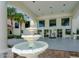 Building entrance with fountain and sitting area at 1 John Anderson Dr # 1070, Ormond Beach, FL 32176
