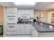 Well-equipped kitchen with white cabinets and double oven at 1 John Anderson Dr # 1070, Ormond Beach, FL 32176