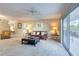 Living room with leather sofa and access to balcony at 1 John Anderson Dr # 1070, Ormond Beach, FL 32176