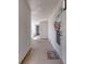 Bright hallway with access to condo unit and amenities at 1 John Anderson Dr # 1070, Ormond Beach, FL 32176